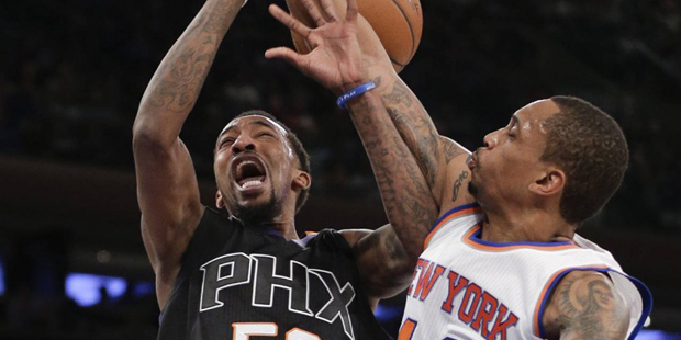 Phoenix Suns guard Jordan McRae (52) is fouled while shooting against New York Knicks forward Lance...