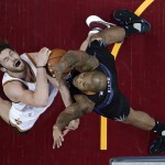 Cleveland Cavaliers' Kevin Love, left, is stopped by Phoenix Suns' P.J. Tucker during the first half of an NBA basketball game Wednesday, Jan. 27, 2016, in Cleveland. (AP Photo/Tony Dejak)