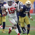 Ohio State running back Ezekiel Elliott (15) breaks free for a touchdown run against Notre Dame during the second half of the Fiesta Bowl NCAA College football game, Friday, Jan. 1, 2016, in Glendale, Ariz.  (AP Photo/Ross D. Franklin)