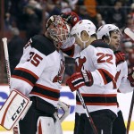 New Jersey Devils goalie Cory Schneider (35) is congratulated by teammate Jordin Tootoo after his shutout in a 2-0 victory against the Arizona Coyotes during an NHL hockey game, Saturday, Jan. 16, 2016, in Glendale, Ariz.  (AP Photo/Ralph Freso)