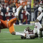 Alabama's Reuben Foster (10) tackles Clemson's Wayne Gallman for a loss during the first half of the NCAA college football playoff championship game Monday, Jan. 11, 2016, in Glendale, Ariz. (AP Photo/David J. Phillip)