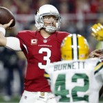 Arizona Cardinals quarterback Carson Palmer (3) throws under pressure from Green Bay Packers strong safety Morgan Burnett (42) during the first half of an NFL divisional playoff football game, Saturday, Jan. 16, 2016, in Glendale, Ariz. (AP Photo/Ross D. Franklin)