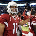 Arizona Cardinals' Larry Fitzgerald stands with his teammates before the NFL football NFC Championship game against the Carolina Panthers, Sunday, Jan. 24, 2016, in Charlotte, N.C. (AP Photo/Mike McCarn)