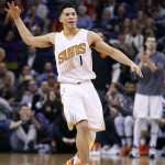 Phoenix Suns' Devin Booker celebrates a 3 point shot against the Charlotte Hornets during the second half of an NBA basketball game, Wednesday, Jan. 6, 2016, in Phoenix.  The Suns defeated the Hornets 111-102. (AP Photo/Ross D. Franklin)