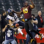West Virginia wide receiver Daikiel Shorts (6) can't make the catch next to Arizona State defensive back Kweishi Brown (10) during the first half of the Cactus Bowl NCAA college football game Saturday, Jan. 2, 2016, in Phoenix. (AP Photo/Ross D. Franklin)