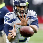 Seattle Seahawks quarterback Russell Wilson (3) warms up prior to an NFL football game against the Arizona Cardinals, Sunday, Jan. 3, 2016, in Glendale, Ariz. (AP Photo/Ross D. Franklin)