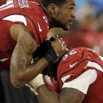 Arizona Cardinals' Patrick Peterson (21) consoles Frostee Rucker during the second half the NFL football NFC Championship game against the Carolina Panthers Sunday, Jan. 24, 2016, in Charlotte, N.C. (AP Photo/Bob Leverone)