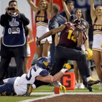 Arizona State wide receiver Tim White (12) runs in a touchdown catch as West Virginia linebacker Nick Kwiatkoski (35) defends during the second half of the Cactus Bowl NCAA college football game, Saturday, Jan. 2, 2016, in Phoenix. (AP Photo/Ross D. Franklin)