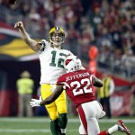 Green Bay Packers quarterback Aaron Rodgers (12) throws under pressure from Arizona Cardinals strong safety Tony Jefferson (22) during the first half of an NFL divisional playoff football game, Saturday, Jan. 16, 2016, in Glendale, Ariz. (AP Photo/Ross D. Franklin)