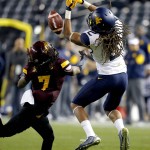 West Virginia wide receiver Ka'Raun White (2) can't make the catch as Arizona State defensive back Solomon Means (7) defends during the first half of the Cactus Bowl NCAA college football game, Saturday, Jan. 2, 2016, in Phoenix. (AP Photo/Ross D. Franklin)
