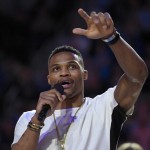 Former UCLA basketball player and current player for the Oklahoma Thunder Russell Westbrook speaks to the crowd after being honored with a basketball court named after him following the first half of an NCAA college basketball game between UCLA and Arizona, Thursday, Jan. 7, 2016, in Los Angeles. (AP Photo/Mark J. Terrill)