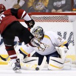 Nashville Predators' Carter Hutton (30) makes a save on a penalty shot by Arizona Coyotes' Anthony Duclair, left, during the first period of an NHL hockey game Saturday, Jan. 9, 2016, in Glendale, Ariz. (AP Photo/Ross D. Franklin)