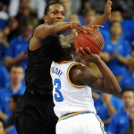 Arizona State's Willie Atwood, top, blocks a shot by UCLA's Aaron Holiday in the first half of an NCAA college basketball game in Los Angeles, Saturday, Jan. 9, 2016. (AP Photo/Michael Owen Baker)