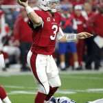 Arizona Cardinals quarterback Carson Palmer (3) throws against the Seattle Seahawks during the first half of an NFL football game, Sunday, Jan. 3, 2016, in Glendale, Ariz. (AP Photo/Ross D. Franklin)