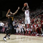 Stanford guard Marcus Allen (15) shoots over Arizona State guard Tra Holder (0) during the second half of an NCAA college basketball game Saturday, Jan. 23, 2016, in Stanford, Calif. Stanford won 75-73. (AP Photo/Marcio Jose Sanchez)