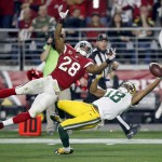 Green Bay Packers wide receiver Randall Cobb (18) makes a one-handed catch but has it called back on a penalty as Arizona Cardinals cornerback Justin Bethel (28) defends during the first half of an NFL divisional playoff football game, Saturday, Jan. 16, 2016, in Glendale, Ariz. Cobb left the game injured after the catch. (AP Photo/Rick Scuteri)