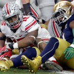 Ohio State running back Ezekiel Elliott (15) looks to his bench after scoring a touchdown against Notre Dame during the first half of the Fiesta Bowl NCAA College football game, Friday, Jan. 1, 2016, in Glendale, Ariz.  (AP Photo/Rick Scuteri)