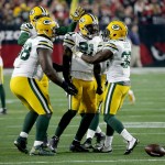 Green Bay Packers free safety Ha Ha Clinton-Dix (21) celebrates his interception against the Arizona Cardinals with Chris Banjo (32) during the second half of an NFL divisional playoff football game, Saturday, Jan. 16, 2016, in Glendale, Ariz. (AP Photo/Ross D. Franklin)