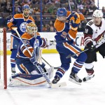 Arizona Coyotes' Shane Doan (19) battles in front with Edmonton Oilers' Justin Schultz (19) as goalie Cam Talbot (33) makes the save during first period NHL action in Edmonton, on Saturday, Jan. 2, 2016.(Jason Franson/The Canadian Press via AP)