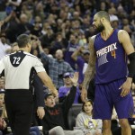 Phoenix Suns center Tyson Chandler, right, has words for official J.T. Orr, after Orr ejected him during the second half an NBA basketball game against the Sacramento Kings, Saturday, Jan. 2, 2016, in Sacramento, Calif.  The Kings won 142-119.  (AP Photo/Rich Pedroncelli)
