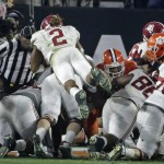 Alabama's Derrick Henry (2) dives into the end zone for a touchdown during the first half of the NCAA college football playoff championship game against Clemson Monday, Jan. 11, 2016, in Glendale, Ariz. (AP Photo/Chris Carlson)