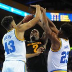 Arizona State's Willie Atwood, center, is challenged by UCLA's Jonah Bolden, left, and Tony Parker in the first half of an NCAA college basketball game in Los Angeles, Saturday, Jan. 9, 2016. (AP Photo/Michael Owen Baker)
