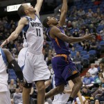 Phoenix Suns guard Brandon Knight, right, goes up past Minnesota Timberwolves forward Tayshaun Prince (12) for a shot during the second half of an NBA basketball game in Minneapolis, Sunday, Jan. 17, 2016. The Timberwolves won 117-87. (AP Photo/Ann Heisenfelt)