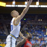 UCLA guard Bryce Alford, left, shoots as Arizona guard Kadeem Allen defends during the first half of an NCAA college basketball game, Thursday, Jan. 7, 2016, in Los Angeles. (AP Photo/Mark J. Terrill)