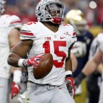 Ohio State running back Ezekiel Elliott (15) celebrates after scoring a touchdown against Notre Dame during the first half of the Fiesta Bowl NCAA College football game, Friday, Jan. 1, 2016, in Glendale, Ariz.  (AP Photo/Rick Scuteri)