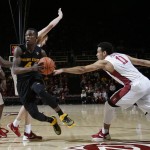 Arizona State guard Gerry Blakes (4) dribbles between Stanford guard Dorian Pickens (11) and guard Marcus Allen, left, during the first half of an NCAA college basketball game Saturday, Jan. 23, 2016, in Stanford, Calif. (AP Photo/Marcio Jose Sanchez)