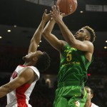Oregon guard Tyler Dorsey (5) is fouled by Arizona guard Parker Jackson-Cartwright during the first half of an NCAA college basketball game Thursday, Jan. 28, 2016, in Tucson, Ariz. (AP Photo/Rick Scuteri)