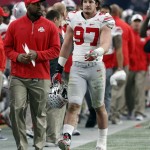 Ohio State defensive lineman Joey Bosa (97) walks off the field after he was ejected for targeting during the first half of the Fiesta Bowl NCAA College football game against Notre Dame, Friday, Jan. 1, 2016, in Glendale, Ariz.  (AP Photo/Rick Scuteri)
