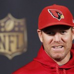 Arizona Cardinals quarterback Carson Palmer smiles as he answers a question during a news conference at the Cardinals NFL football training facility Wednesday, Jan. 20, 2016, in Tempe, Ariz.  The Cardinals will face the Carolina Panthers in the NFC Championship game on Sunday in Charlotte. (AP Photo/Ross D. Franklin)