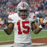 Ohio State running back Ezekiel Elliott (15) gestures as he celebrates his fourth touchdown of the game against Notre Dame  during the second half of the Fiesta Bowl NCAA College football game, Friday, Jan. 1, 2016, in Glendale, Ariz.  (AP Photo/Ross D. Franklin)