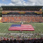 A United States flag is displayed while fans sing the national anthem before the NFL Pro Bowl football game, Sunday, Jan. 31, 2016, in Honolulu. (AP Photo/Eugene Tanner)