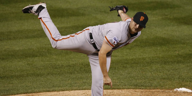 San Francisco Giants relief pitcher Cody Hall works against the Colorado Rockies in the seventh inn...