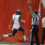 West Virginia's Shelton Gibson (1) scores a touchdown during the first half of the Cactus Bowl NCAA college football game against Saturday, Jan. 2, 2016, in Phoenix. (AP Photo/Ross D. Franklin)