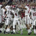 Alabama's Eddie Jackson (4) celebrates after his interception during the first half of the NCAA college football playoff championship game against Clemson Monday, Jan. 11, 2016, in Glendale, Ariz. (AP Photo/Chris Carlson)