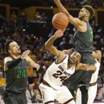 Arizona State guard Andre Spight (24) battles for the loose ball with Oregon forward Dillon Brooks (24) and Tyler Dorsey during the first half of an NCAA college basketball game, Sunday, Jan. 31, 2016, in Tempe, Ariz. (AP Photo/Rick Scuteri)