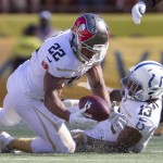 Tampa Bay Buccaneers running back Doug Martin (22) of Team Rice recovers a fumble in the second quarter of the NFL Pro Bowl football game, Sunday, Jan. 31, 2016, in Honolulu. Indianapolis Colts wide receiver T. Y. Hilton (13) was also in on the play. (AP Photo/Eugene Tanner)