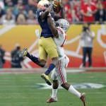 Notre Dame wide receiver Chris Brown, left, makes the catch as Ohio State cornerback Eli Apple defends during the first half of the Fiesta Bowl NCAA College football game, Friday, Jan. 1, 2016, in Glendale, Ariz.  (AP Photo/Ross D. Franklin)