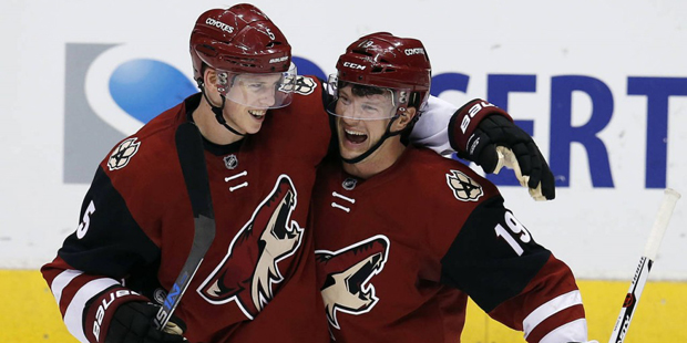 Arizona Coyotes defenseman Connor Murphy and Shane Doan (19) celebrate the Coyotes defeated the Win...