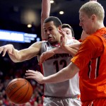 Arizona forward Ryan Anderson (12) and Oregon State forward Olaf Schaftenaar vie for the loose ball during the second half of an NCAA college basketball game Saturday, Jan. 30, 2016, in Tucson, Ariz. Arizona defeated Oregon State 80-63. (AP Photo/Rick Scuteri)