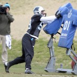 Carolina Panthers' Luke Kuechly (59) hits a tackling dummy during NFL football practice in Charlotte, N.C., as the team prepares for the NFC Championship game against the Arizona Cardinals, Wednesday, Jan. 20, 2016. (David Foster IIICharlotte Observer via AP)