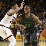 Oregon forward Elgin Cook (23) drives past Arizona State guard Andre Spight during the first half of an NCAA college basketball game, Sunday, Jan. 31, 2016, in Tempe, Ariz. (AP Photo/Rick Scuteri)
