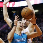 Charlotte Hornets' Jeremy Lin (7) grimaces as he is fouled by Phoenix Suns' Mirza Teletovic, right, of Bosnia, during the first half of an NBA basketball game Wednesday, Jan. 6, 2016, in Phoenix. (AP Photo/Ross D. Franklin)