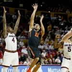 Oregon State's Malcolm Duvivier (11) shoots over Arizona State's Gerry Blakes during the first half of an NCAA college basketball game, Thursday, Jan. 28, 2016, in Tempe, Ariz. (AP Photo/Matt York)