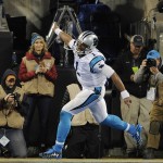 Carolina Panthers' Cam Newton celebrates his touchdown run during the first half the NFL football NFC Championship game against the Arizona Cardinals, Sunday, Jan. 24, 2016, in Charlotte, N.C. (AP Photo/Mike McCarn)