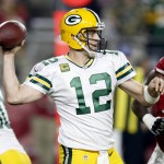 Green Bay Packers quarterback Aaron Rodgers (12) throws against the Arizona Cardinals during the first half of an NFL divisional playoff football game, Saturday, Jan. 16, 2016, in Glendale, Ariz. (AP Photo/Rick Scuteri)