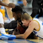 Arizona State's Savon Goodman and UCLA's Bryce Alford battle for the ball in the second half of an NCAA college basketball game in Los Angeles, Saturday, Jan. 9, 2016. UCLA won 81-74. (AP Photo/Michael Owen Baker)